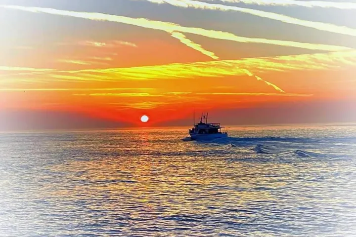 a sunset over a body of water