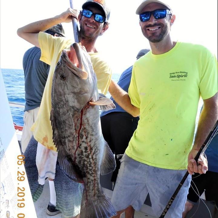 a man holding a fish