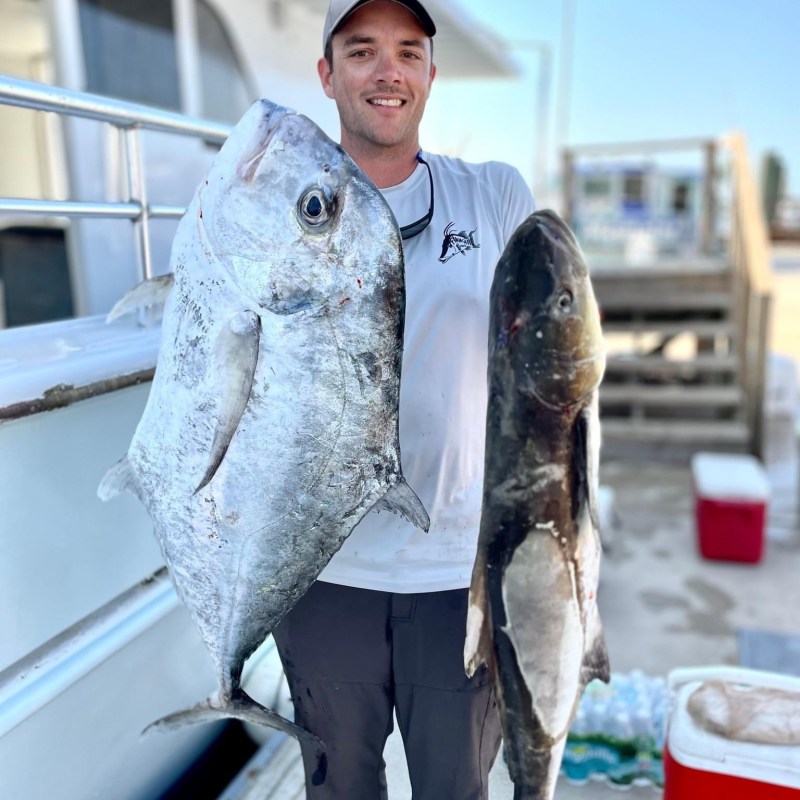 a person holding a fish