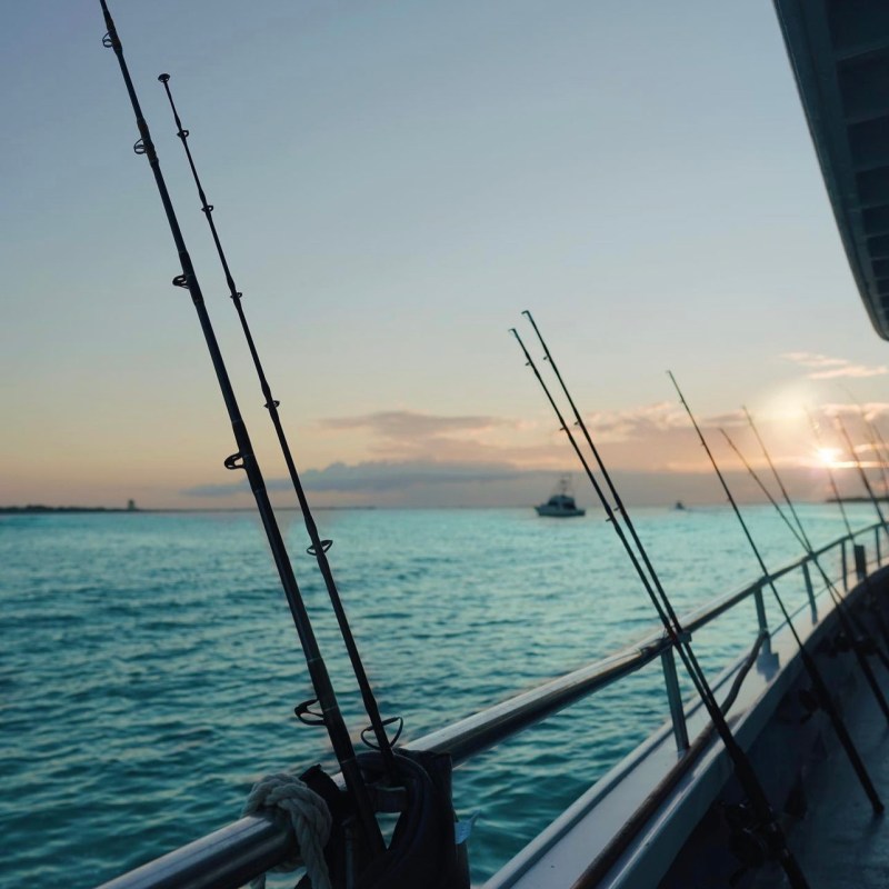 a boat is docked next to a body of water